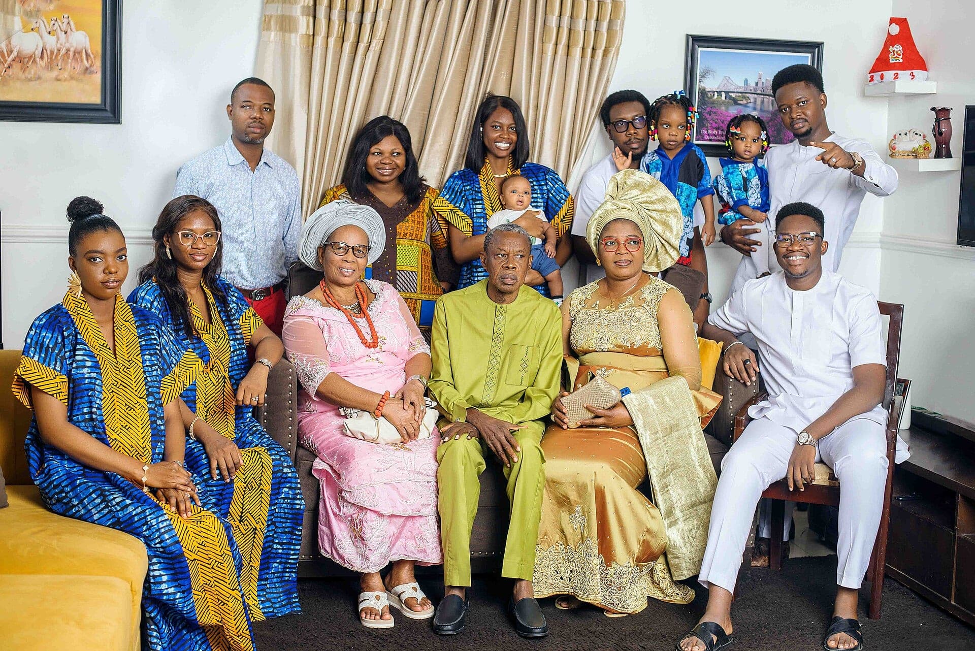 Three generations of a Nigerian family in matching traditional dress